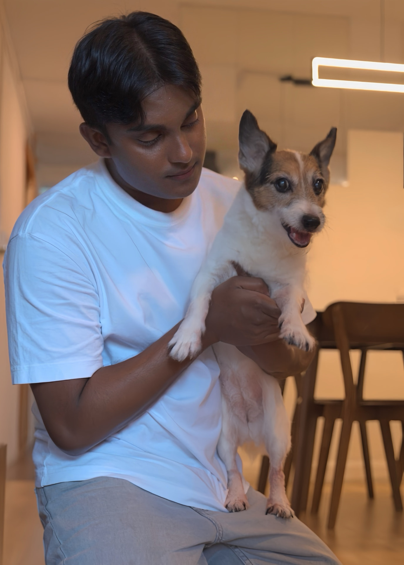 Dino holding Cookie in his arms