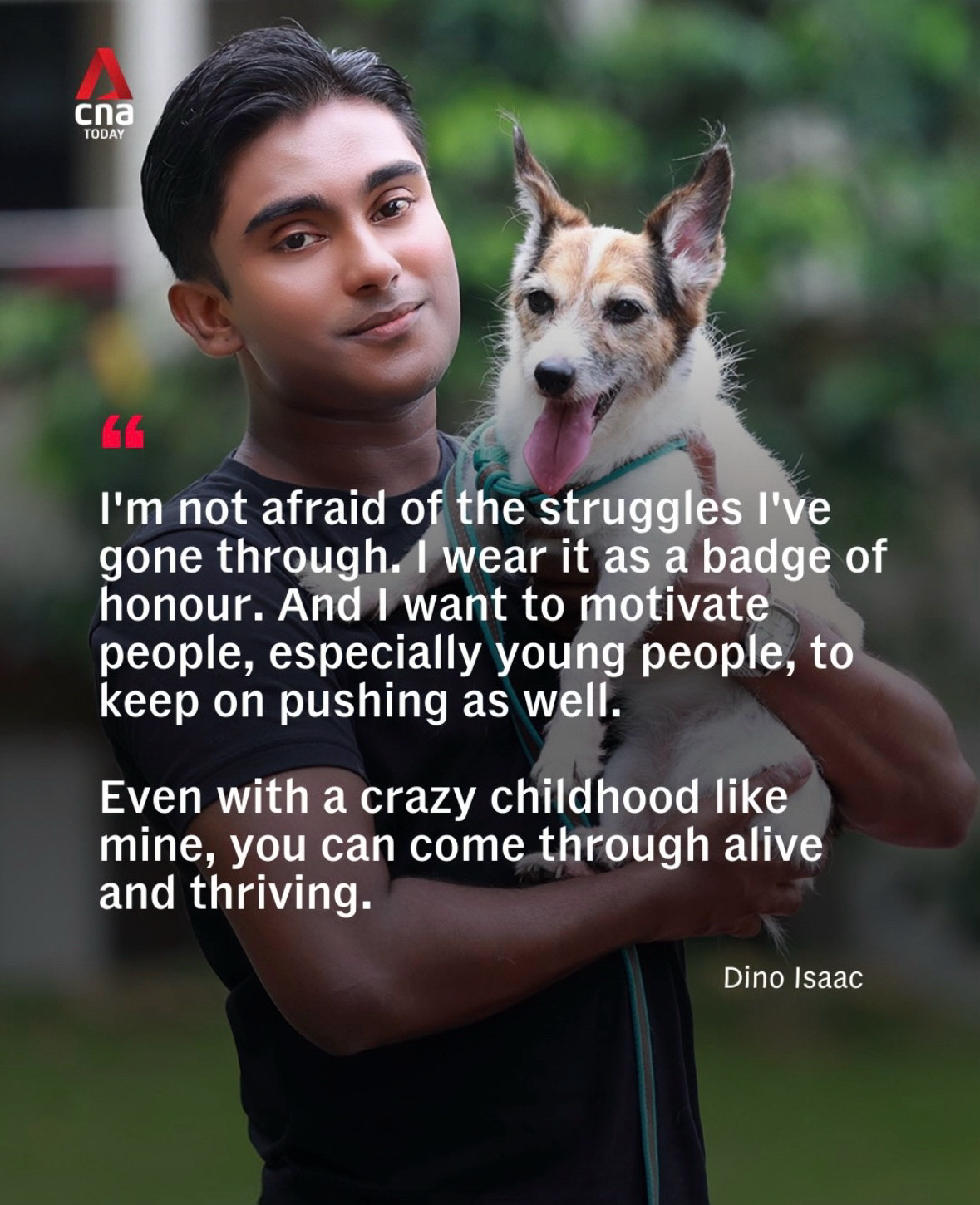 Dino Isaac smiling while holding his dog